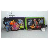 Pair of Laurel Burch clutch cases, both with dog