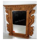Medieval style mirror with wooden dragon frame.