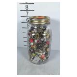 Ball jar filled with costume jewelry