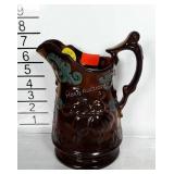Copper Luster pitcher with handpainted details.
