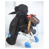 Ride on toy and teddy bear