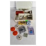 Sewing machine accessories in organizer.