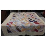 Early quilt, muted colors, heavy, shows wear as