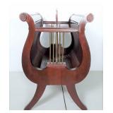 Lyre shaped solid wood magazine rack with metal