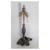 Early lamp, base is heavy metal with dogwood
