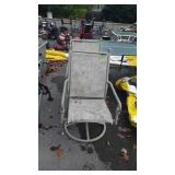 Two patio chairs, one does swivel