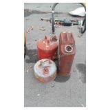 Three metal fuel cans