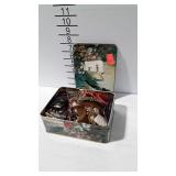 Tin of costume jewelry