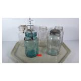 Quart size Mason jars, two Ball and three Atlas