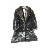 Black faux fur with brown trim, no size but seems