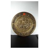 Metal gold tone wall decor 
. 16" diameter.