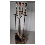 Brass fireplace tools in stand