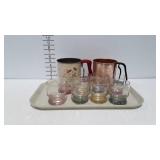 Two flour sifters and 8 Beverage glasses