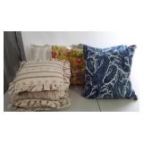 Pillows, throw pillows and a one chair pad