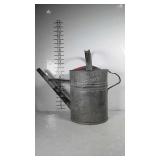Galvanized watering can.