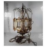 Brass tone swag lamp with hanging prisms.   It is