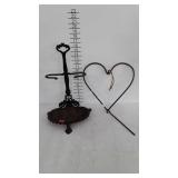 Cast iron, heart shaped dinner bell and fireplace