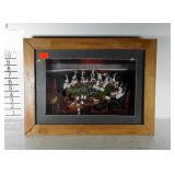 Dogs playing poker in shadow box.  Has some loose