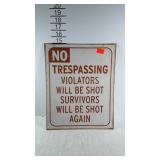 Metal NO TRESPASSING sign