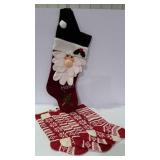 Holiday stockings, six knit stockings and a large