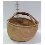 Lovely woven basket with leather wrapped handle