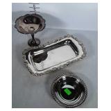 Silver plated serving dishes.