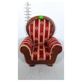 Upholstered  doll chair. Nice shape.
