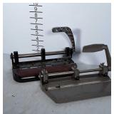 Two 3 hole punch tools.