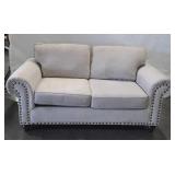 Gray love seat, does show usewear on arm
