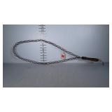 Wood and metal rug beater. 33 inches long.