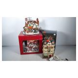 Lighted holiday village houses with boxes,