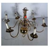 Brass finish chandelier. Arms need tightened.
