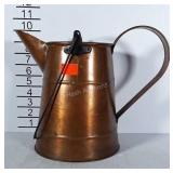 Copper tone pitcher with 2 handles.