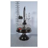 Silver plated condiment castor. Rotates. Has all