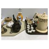 Two trays of glassware Asian decor figurines,