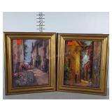 Two outdoor primitive village prints, framed.