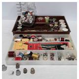 Sewing notions including bobbins, buttons, sewing