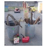 Two galvanized trashcans no lids, with horse