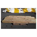Group of six wood posts five are 8 feet long, and