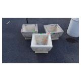 Three concrete planters