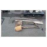 Group of long handled tools, includes shovels,