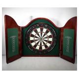 Dart board in wall cupboard