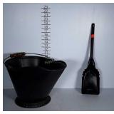 Metal ash bucket with wooden handle and shovel.
