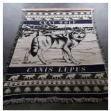 Lap Throw Blanket "Gray Wolf" on wall hanger