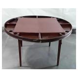 Vintage folding card table, shows age wear.