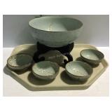 Asian decor with bowl in stand and four small