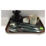 Kitchenware with cutting board, metal spoons,