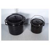 Enamelware cooking pots. One smaller pot with lid