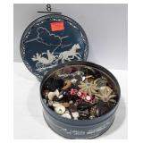 Fruitcake tin filled with buttons, all shapes and