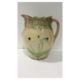 Floral design pottery pitcher